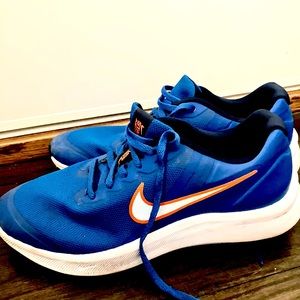 Nike running shoes orange and blue